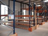 a large room with a lot of shelvings in it