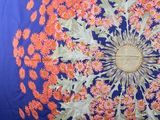 an image of a blue and orange floral print pillow