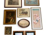 a lot of framed pictures on the wall next to each other