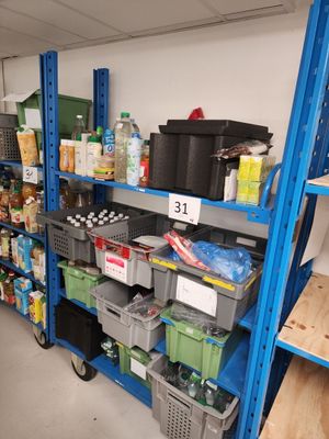 many shelves with various items on them in a store