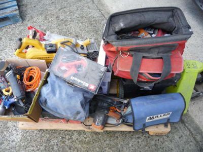 a box full of assorted tools and tools on the ground
