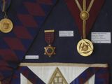 many medals and medals on display in a display case