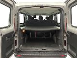 a white van with its doors open and the back of the van is empty