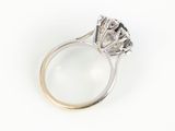 an image of a diamond ring with a magnifying glass