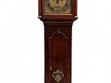 a grandfather clock that is standing in the middle of the room
