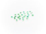 green tourmaline gems on a white background