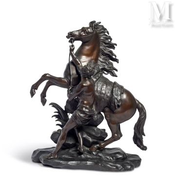 bronze statue of a man on a horse with a man on a horse