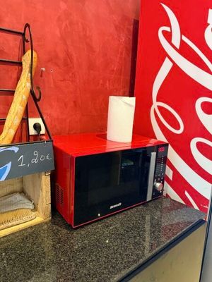 a microwave and a toaster sitting on a counter in a kitchen