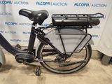 a black bicycle with a basket on the back of it