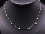 a necklace with pearls on a mannequin mannequin