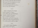 an open book with a poem in it on a table