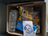 a cardboard box filled with toothbrushes and toothpaste