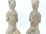 pair of ancient stone figurines of a man and a woman