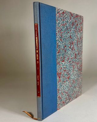 the book is sitting on a white surface with a blue cover