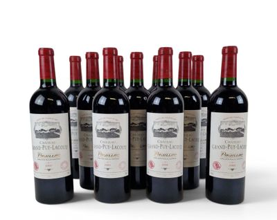 six bottles of red wine lined up in a row on a white surface