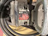 a close up of a machine that is sitting on the ground