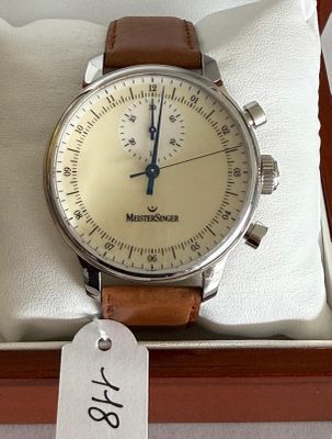 a watch in a box with a price tag on it