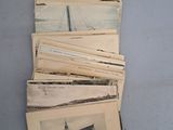 a lot of old postcards sitting on a table