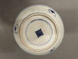 a blue and white plate with a blue and white design on it