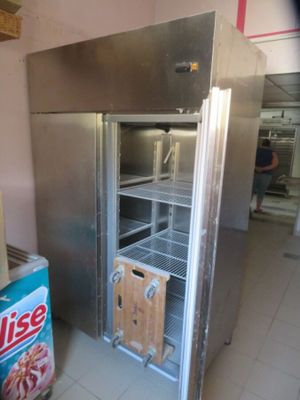 an image of a commercial refrigerator in a kitchen