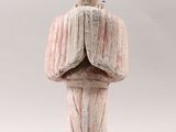 an image of a statue of a man with his hands folded over his face