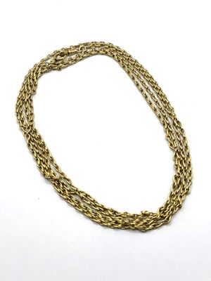 a close up of a gold chain on a white background