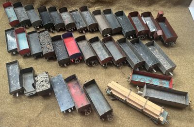 a lot of toy trains that are on the ground