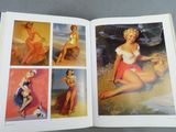 an open book with pictures of pinup girls on the pages