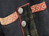 a close up of a jacket with buttons on it