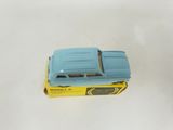 a blue toy car sitting on top of a yellow box