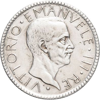 a close up of a coin with a man ' s face on it