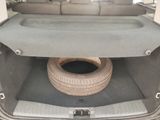 a tire in the trunk of a car with a tire in it