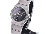 an image of a close up of a wrist watch on a stand