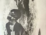 an old poster of a man holding a gun in a field