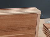 several pieces of wood are stacked on top of each other on a table