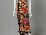 a mannequin dress with a multicolored print and black trim
