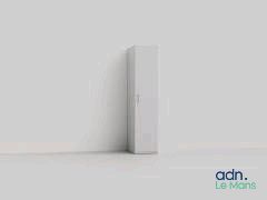 a white refrigerator sitting against a wall in the corner of a room