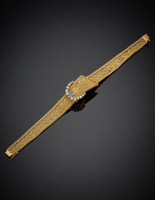 une montre-bracelet en or et diamants, signée Cartier