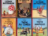 six children ' s books in french are lined up on a table