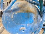 an image of a close up of a blue air compressor