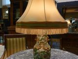 a lamp that is sitting on a table in a room