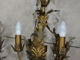 two chandeliers that are on the floor next to each other