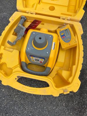 a yellow case with tools inside of it on the ground