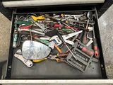 a drawer full of tools that are sitting on the ground