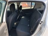the interior of a car with the door open and the passenger seat down