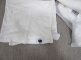 a white shirt that has a black label on it