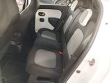 a picture of a small car with a black and white seat cover