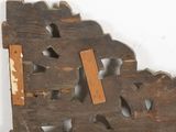 a piece of wood with holes cut out of it