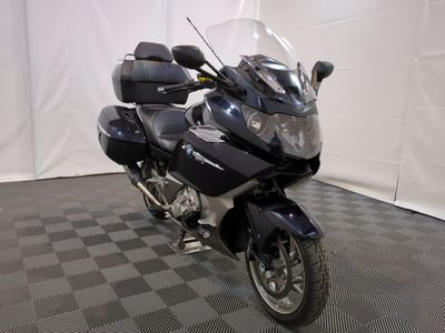a motorcycle that is parked in a room with a checkered floor