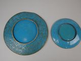 two plates that are sitting next to each other on a table